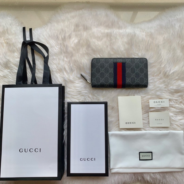 G*u*i leather zip around wallet
