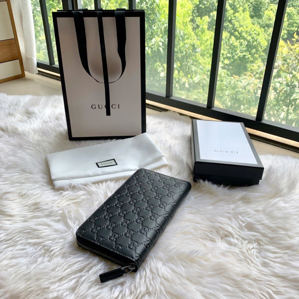G*u*i leather zip around wallet