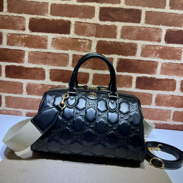 G*u*i gg matelassé leather top handle bag