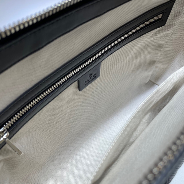 G*u*i gg embossed messenger bag