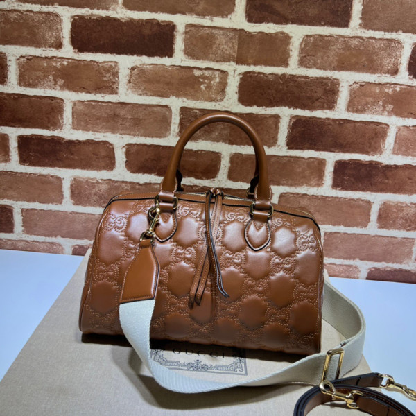 G*u*i gg matelassé leather top handle bag