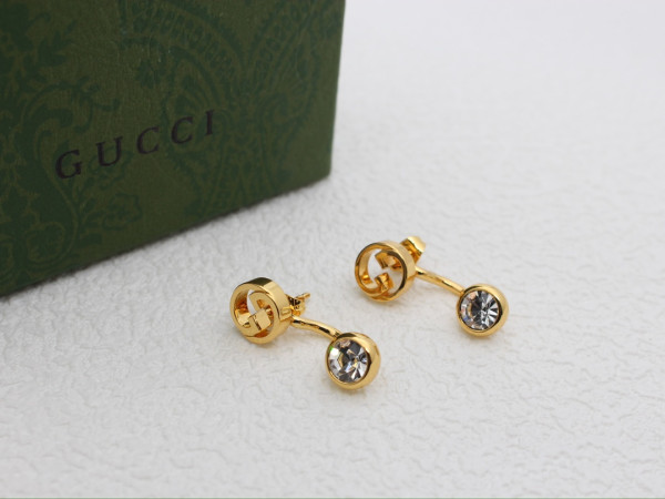 G*u*i earrings