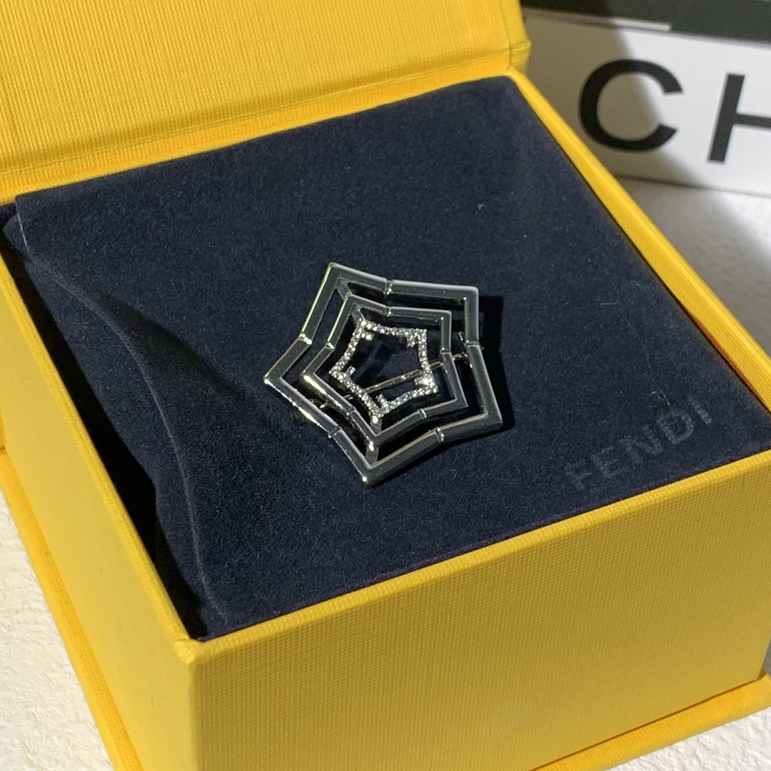 F**di brooch