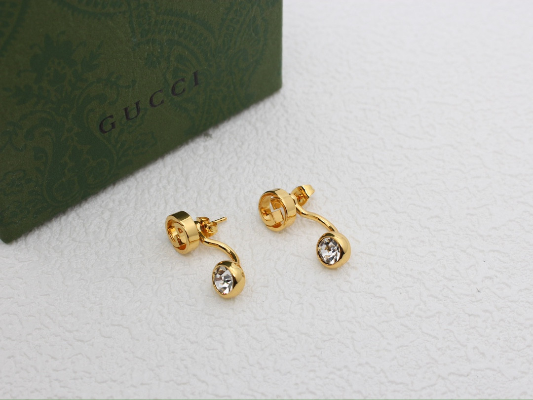 G*u*i earrings